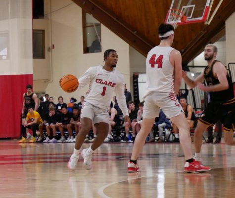 Isaiah Taylor dribbling around a screen set by Kekoa McArdle during Clarks 84-80 victory over Emerson College. All photos courtesy of William Schechter
