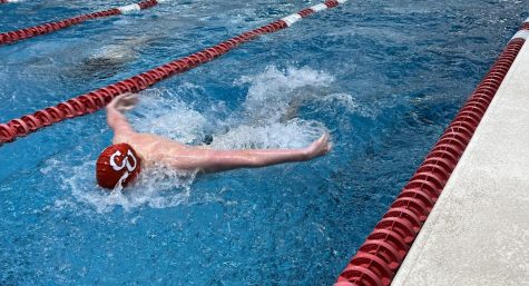 Sophomore Rowan Compton competing in the 100-yard butterfly. 