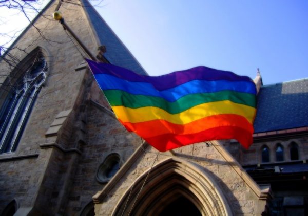 A pride flag hanging from a Boston Church. Photo courtesy of Brian Talbot