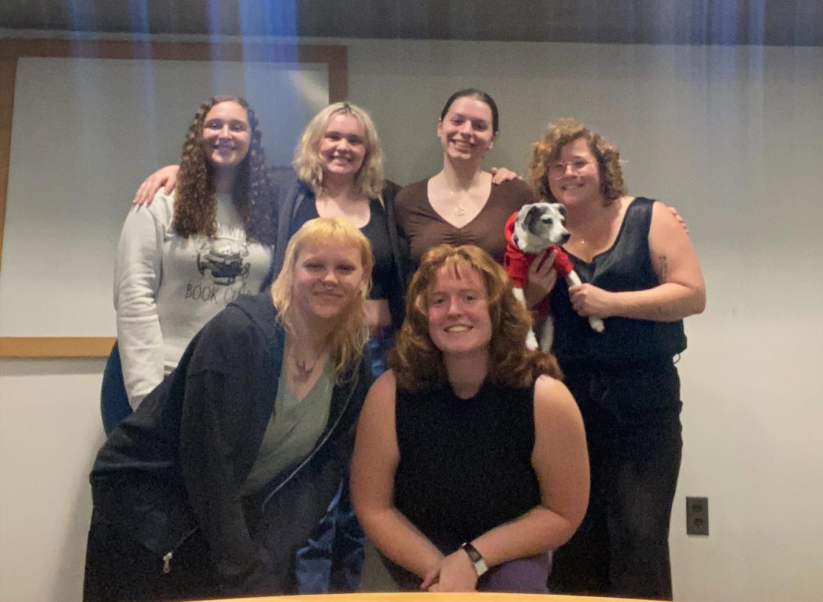 Menstrual Equity Alliance Executive Board. From left to right in the top row: Josie Libonate (sophomore), Riley Forrestal (sophomore), Allison Kimball (junior), and Jacqueline Morrill (professor and club advisor). In the bottom row from left to right are Ali Civilikas (junior) and Amelia Clark (junior). Photo courtesy of Amelia Clark.