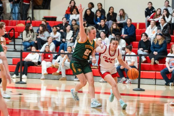 Emma Drefs dribbling toward the hoop.