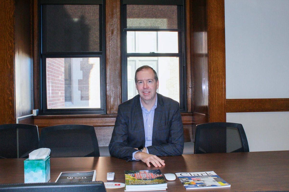 John Magee sitting in his office on the 2nd floor of the Geography Building. 