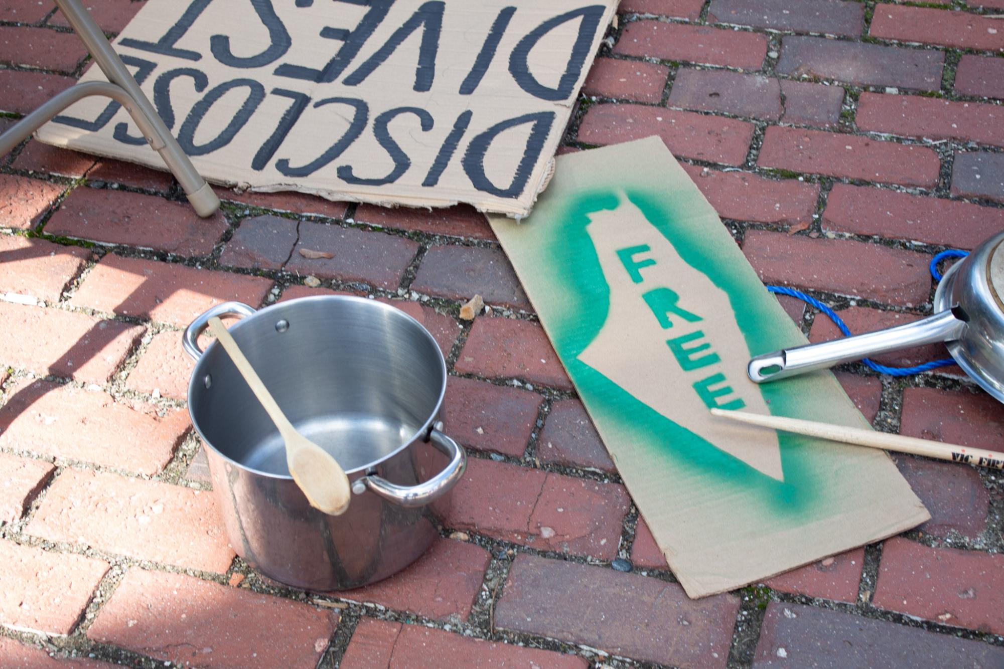 Signs on the ground during the Strike for Palestine on October 10.