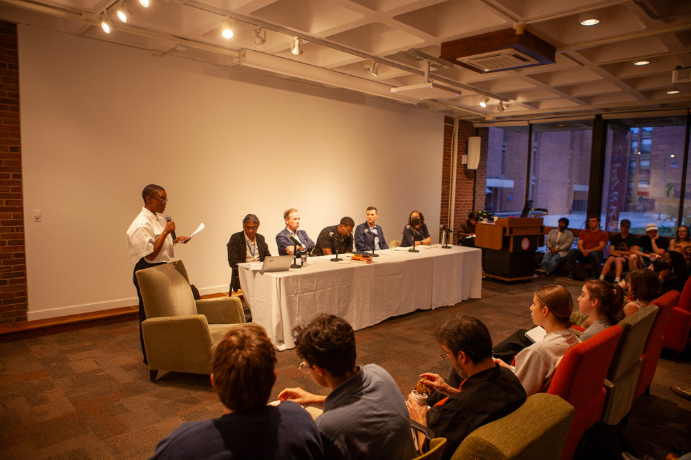 (From left to right) Professors Asha Best, Cyril Ghosh, Robert Boatright,  Ousmane Power-Greene, Jack Delehanty and Johanna Vollhardt in Dana Commons on Wednesday evening.  