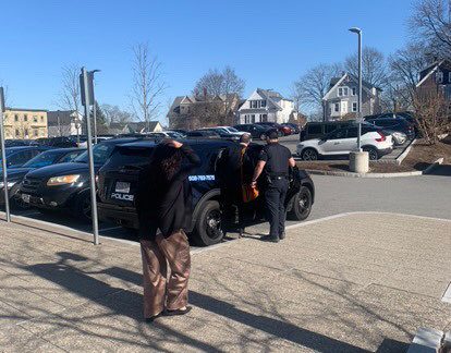 Dean of the college John Magee getting into a police escort